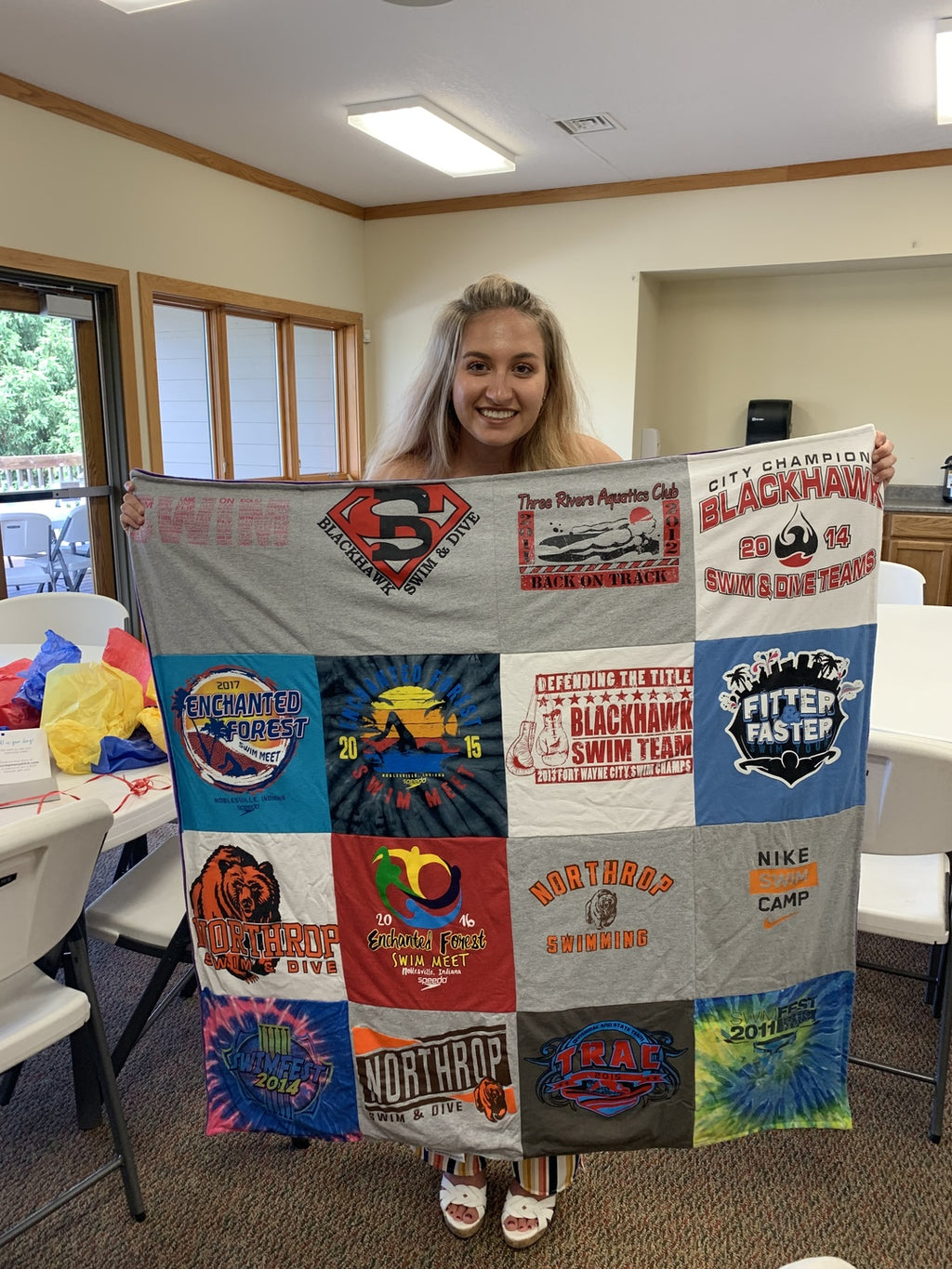 girl holding t-shirt quilt