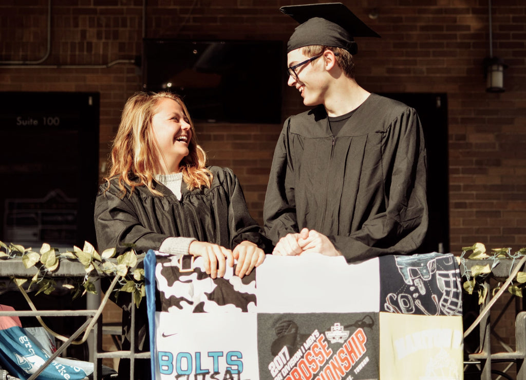 graduates with t-shirt quilt