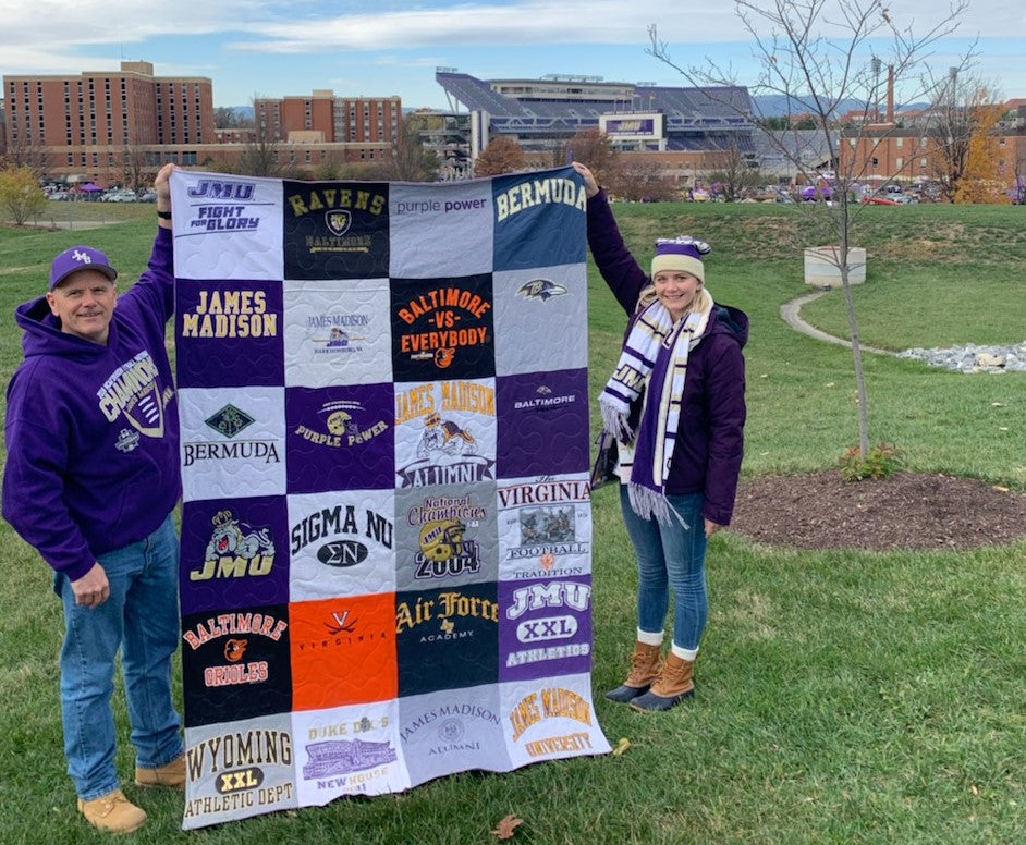 t-shirt quilt held up by two sport fans near Harrisonburg stadium