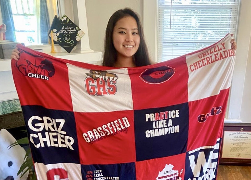 woman holding t-shirt quilt