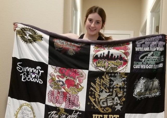 girl holding t-shirt quilt